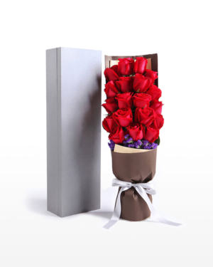 Medium bouquet of 19 red roses and purple 'forget-me-not' flowers presented in an elegant gift box