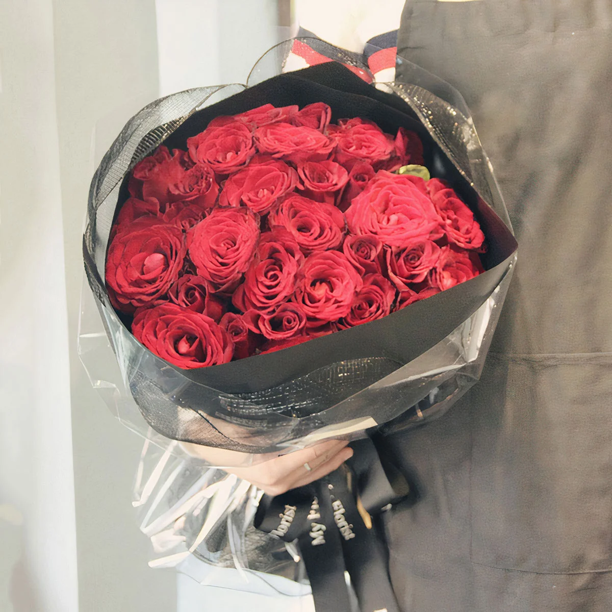 Medium bouquet of 33 premium red roses wrapped in quality matte paper
