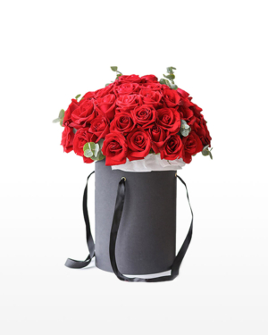 Large bouquet of 52 premium red roses arranged in a cylinder gift box