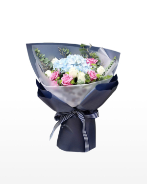 Medium bouquet of blue hydrangeas with purple and white rose accents wrapped in quality matte paper