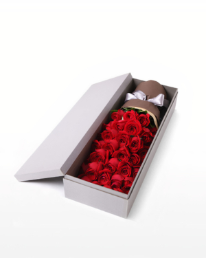 Medium bouquet of 33 premium red roses wrapped in quality matte paper and presented in an elegant gift box
