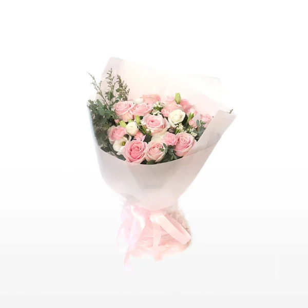 Medium bouquet of pink roses, carnations, eustomas and greenery wrapped in quality matte paper