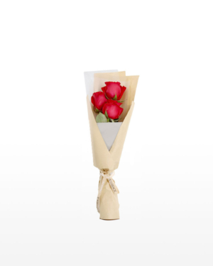 A small bouquet of 3 premium red roses wrapped in brown kraft paper