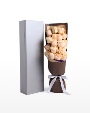 Medium bouquet of 19 yellow roses and purple 'forget-me-not' flowers wrapped in quality matte paper and arranged in an elegant gift box