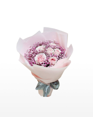Medium bouquet of 6 pink roses and baby's breath flowers wrapped in quality matte paper