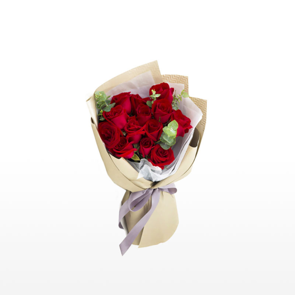 Bouquet of 13 red roses against a white background.