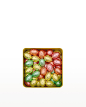 A decorative tin filled with assorted Patchi chocolates in colourful wrappers (yellow, green, orange, and red).