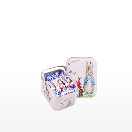 Rectangular tin with a colourful rabbit design, filled with White Rabbit creamy candies.
